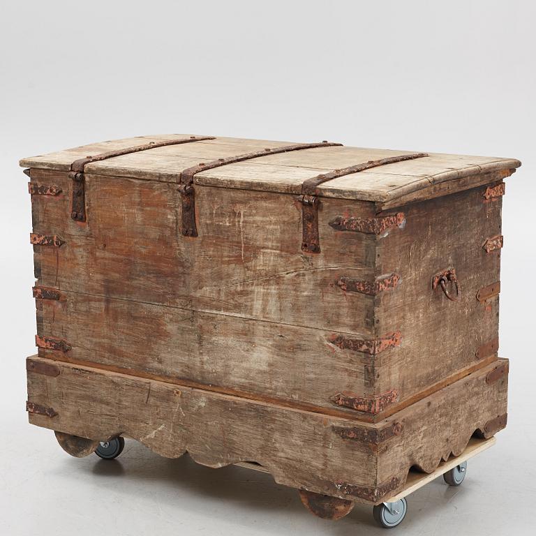 A carved oak chest with wrought iron fittings, 19th Century.