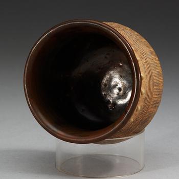 A brown and black glazed rice measurement cup, Song dynasty (960-1279).