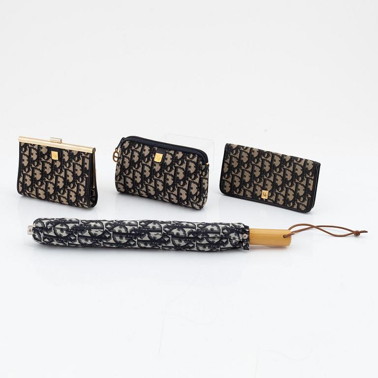 Christian Dior, a black canvas umbrella, toilet bag, coin purse and wallet.