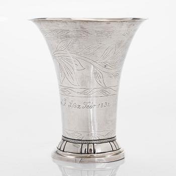 A silver beaker, maker's mark Isak Carlstedt, Porvoo ca. 1831, and silver spoon by Carl Fredrik Borgström, Turku 1803.