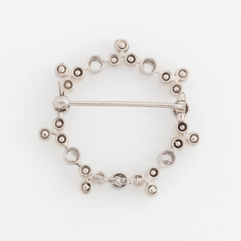 An 18K white gold WA Bolin brooch set with pearls and rose-cut diamonds.