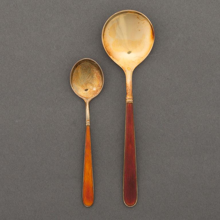 Fourteen Finnish sterling silver and red enamel spoons by Tillander, Helsinki 1950-70s.