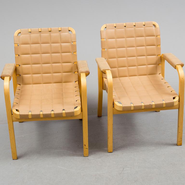 ALVAR AALTO, a pair of mode 45 leather upholstered birch armchairs from Artek, Finland.