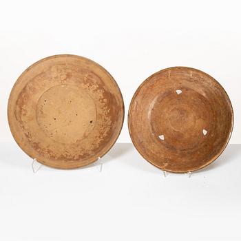 One eathenware bowl and two plates.
