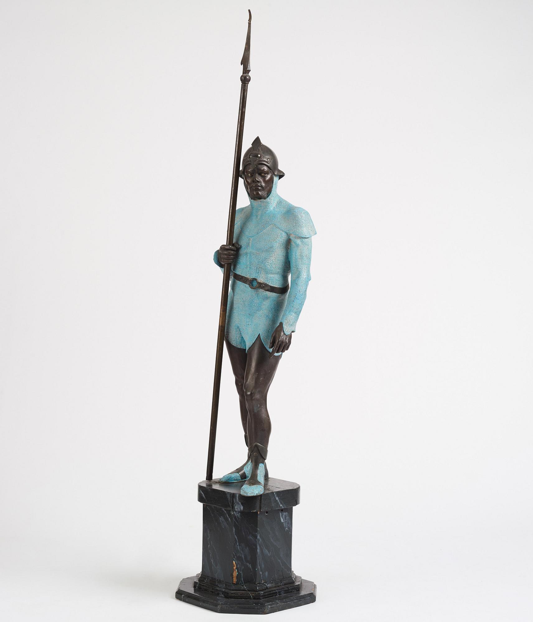 A bronze sculpture of a man in armour, late 19th century.