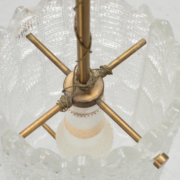 Carl Fagerlund, a pair of brass and glass wall lights and a ceiling light, Orrefors.