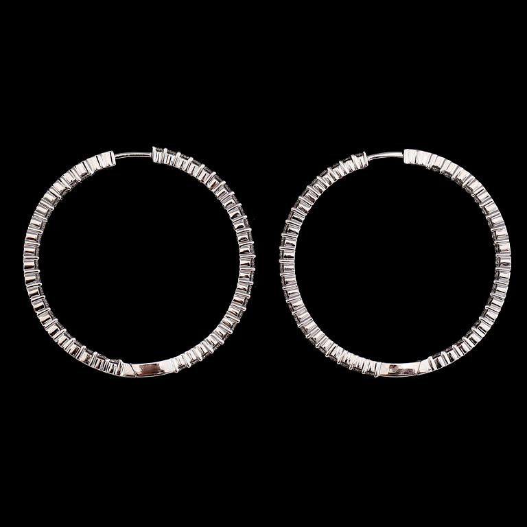 A pair of diamond, 2.64 cts in total, earrings.