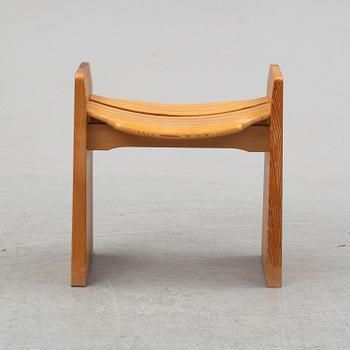 A pine bench by Gilbert Marklund.