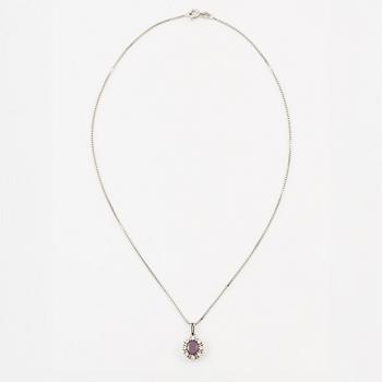Pendant with gold chain, 
Pendant with white gold chain, 
Earrings a pair, rubies with brilliant-cut diamonds.