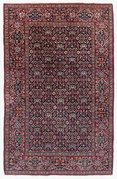 A rug, probably Meshed, semi-antique, c. 180 x 125 cm.