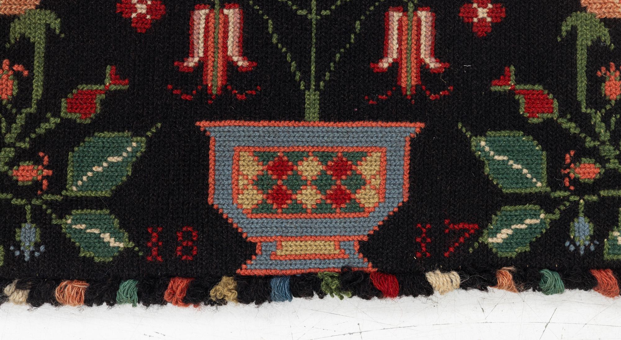 Åkdyna, korsstygnsbroderi, daterad 1817.