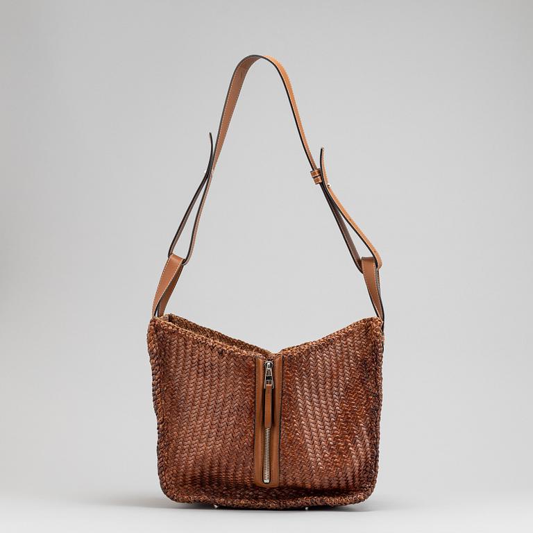 Loewe, a brown woven leather handbag.