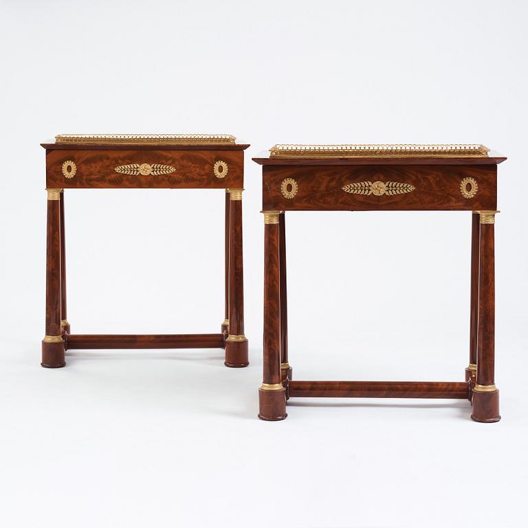 A pair of French Empire gilt bronze-mounted mahogany jardinieres, first half of the 19th century.