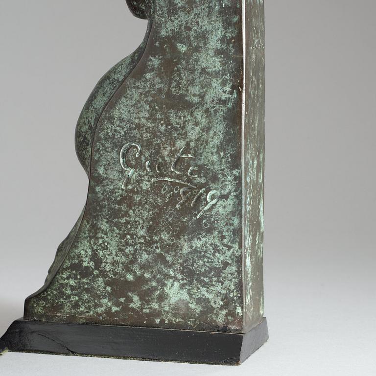 A pair of Axel Gute patinated metal bookends, Sweden 1919.