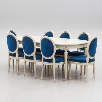 A Gustavian style dining table and eight chairs, late 20th century.