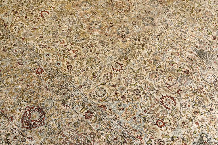 A oriental silk carpet, 350 x 247 cm.