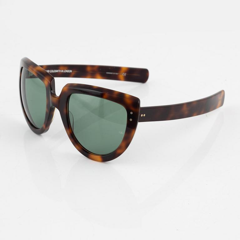 Oliver Goldsmith, a pair of  "Y-not" sunglasses.