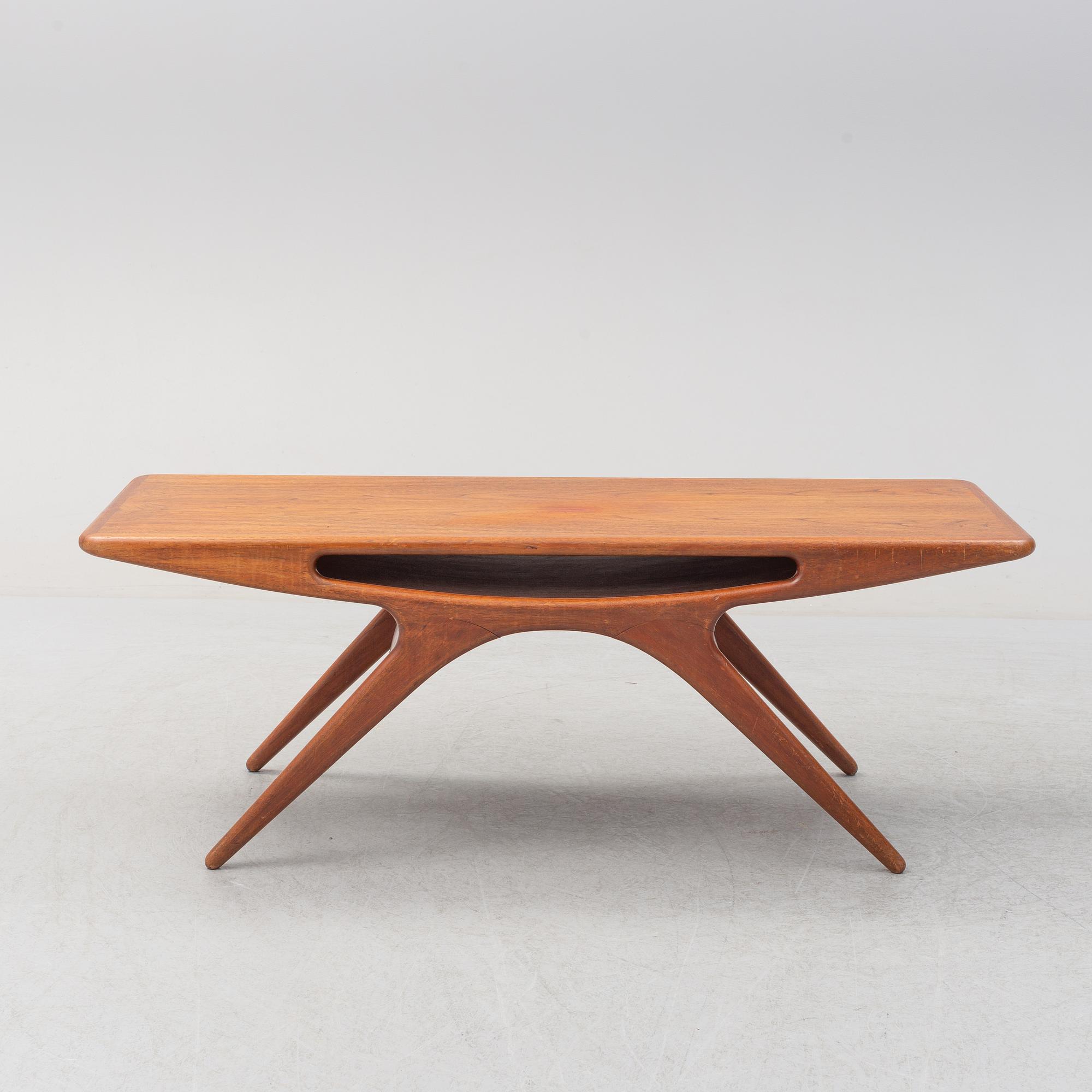 A 1950s teak veneered 'Smile' coffee table by Johannes Andersen for CFC Silkeborg, Denmark.