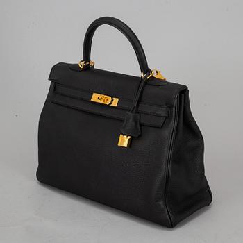 HERMÈS, a 'Kelly 35' black leather bag.