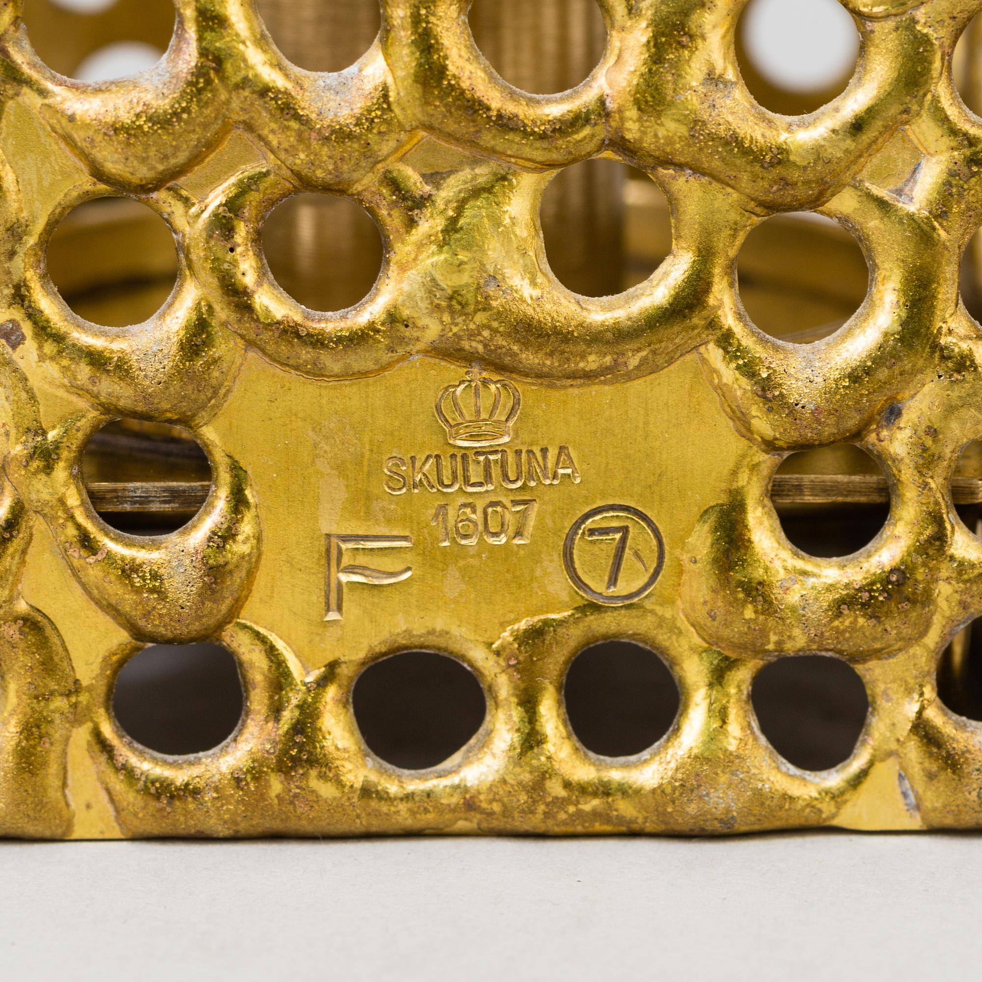 a brass ceiling light by Pierre Forsell for Skultuna.