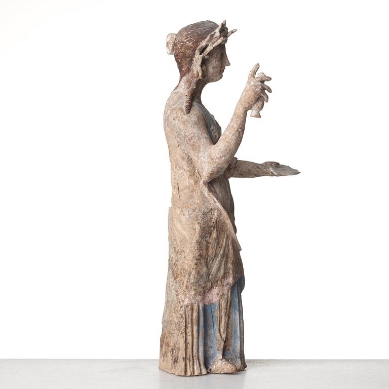 A Greek pottery sculpture of an elegant lady, Hellenistic, probably circa 300 B.C.