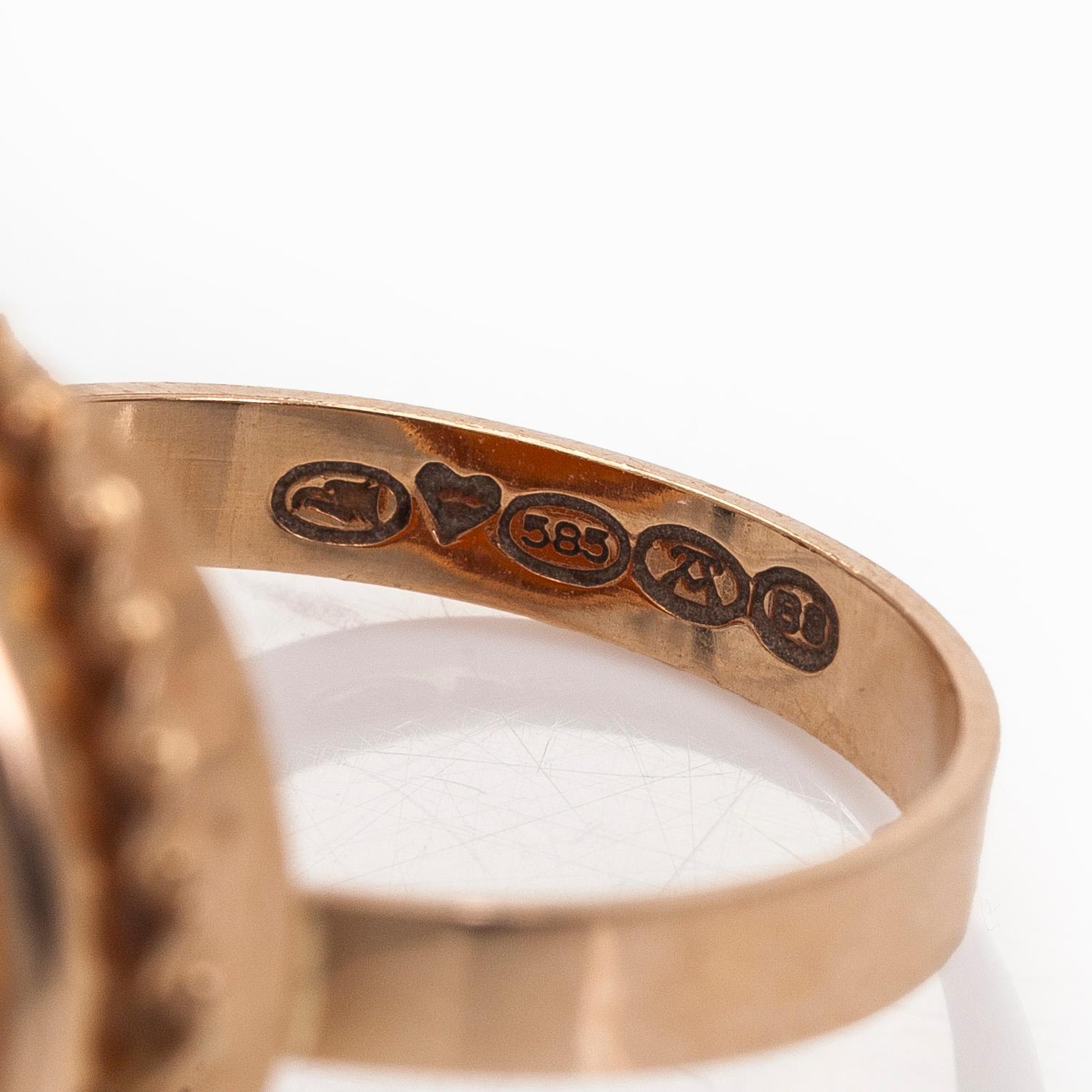 A 14K gold and shell cameo jewelry set, bracelet, pendant/brooch and ring.