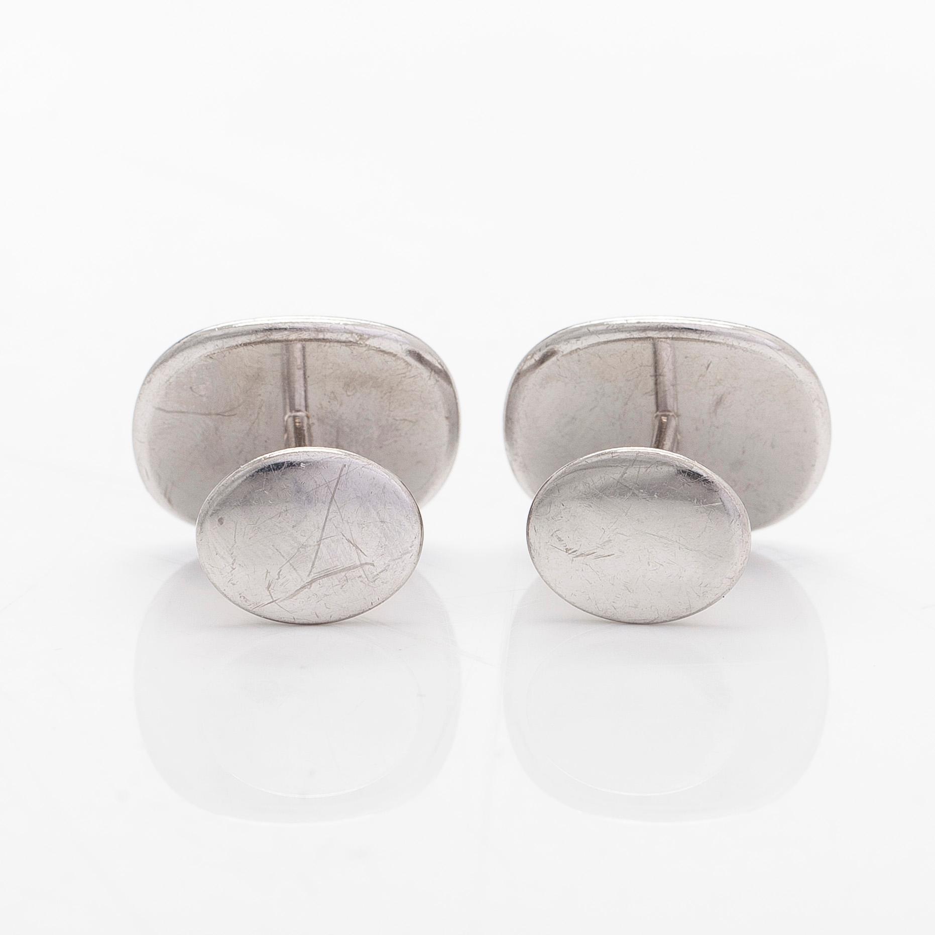 Patek Philippe, a pair of 18K whitegold 'Calatrava' cufflinks.