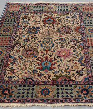 A RUG, a semi-antique Tabriz, ca 198 x 142 cm.