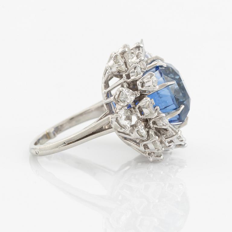 A platinum ring set with a faceted sapphire.