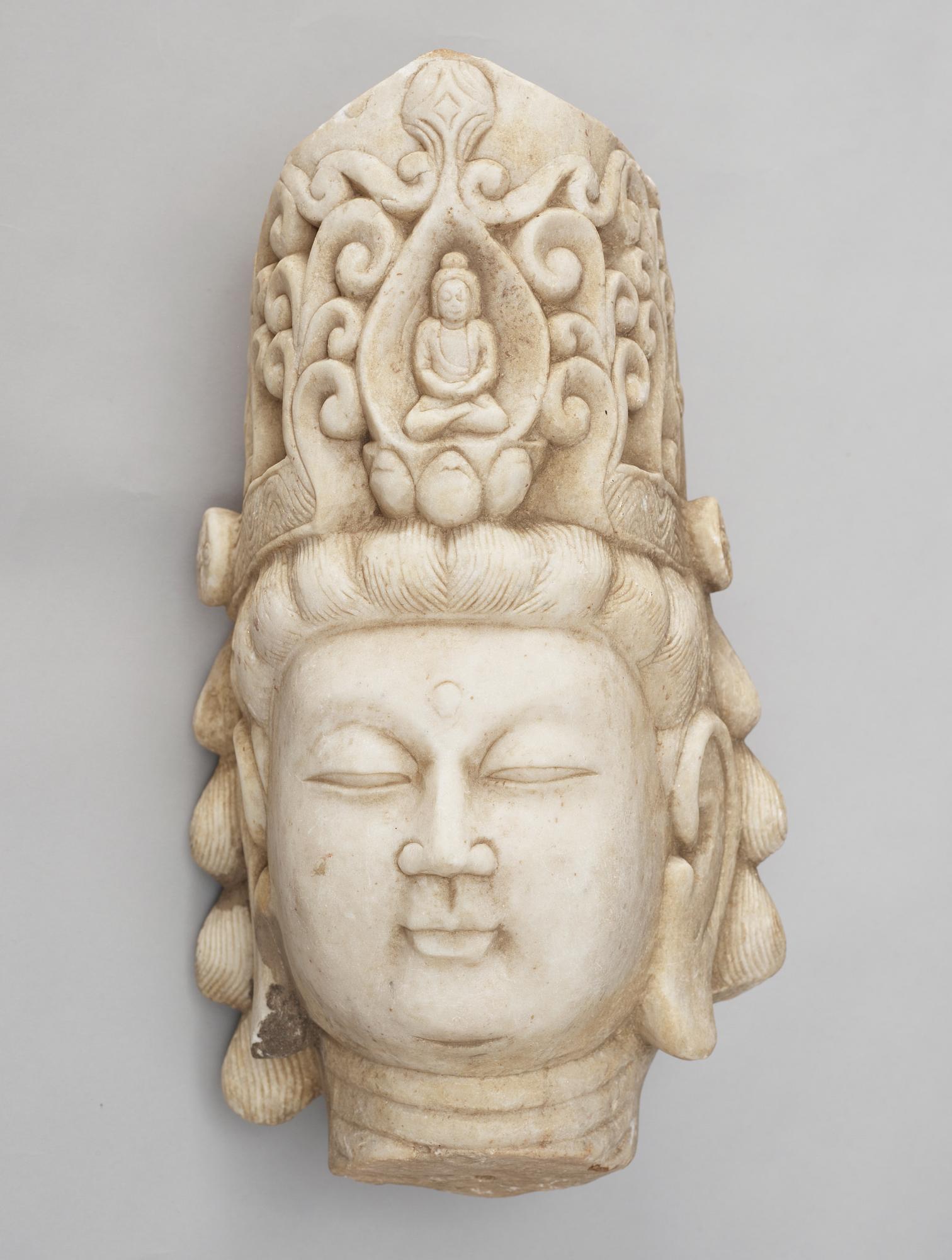 A white stone 20th century buddha head.