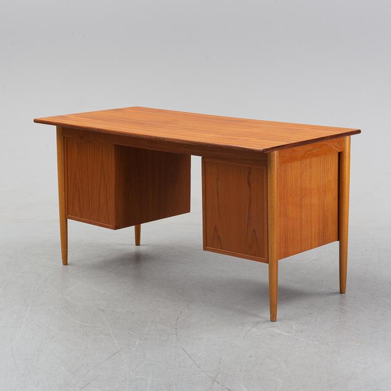 A 1950/60's oak and teak writing desk.