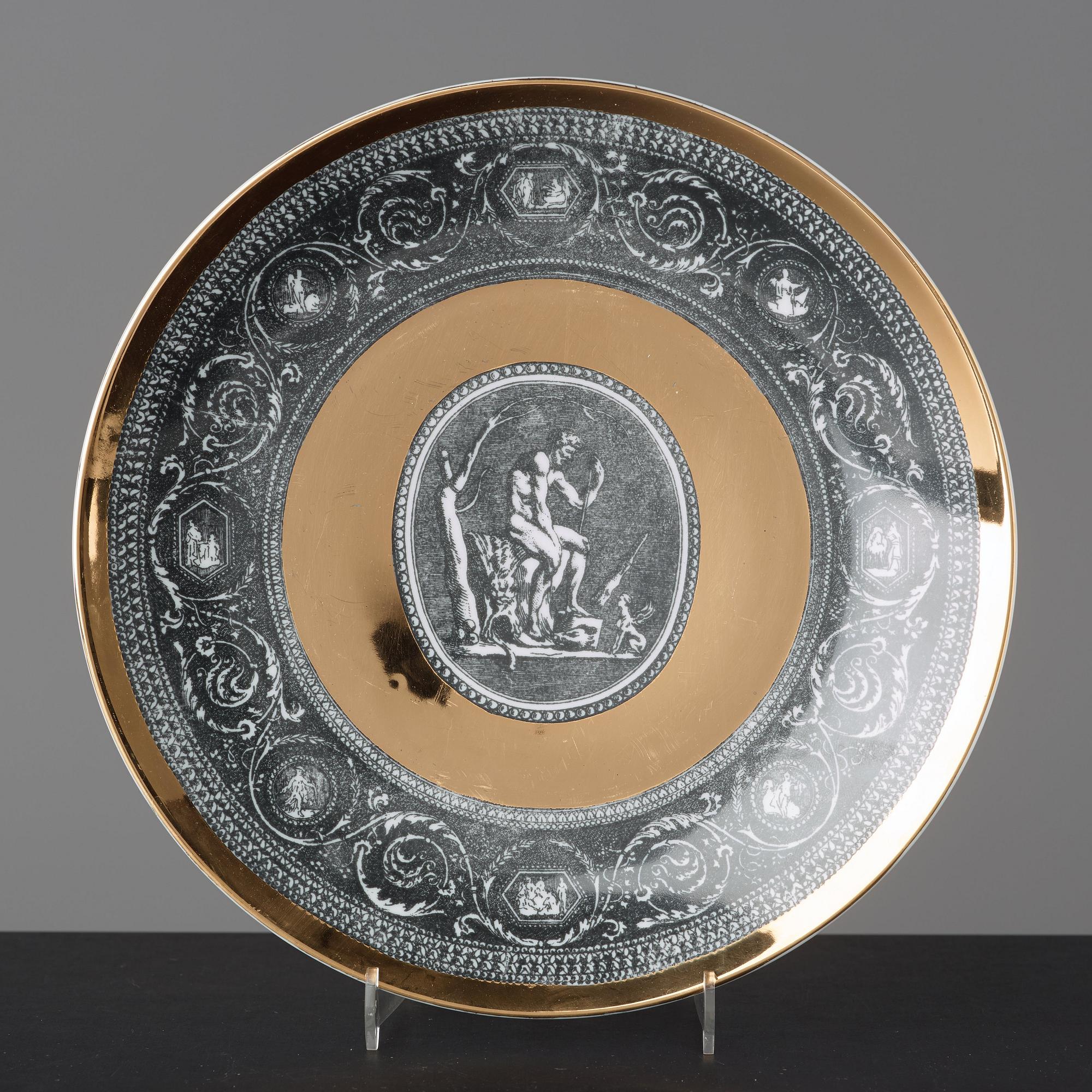 Piero Fornasetti, a set of six "Cammei" porcelain plates, Milano, Italy.