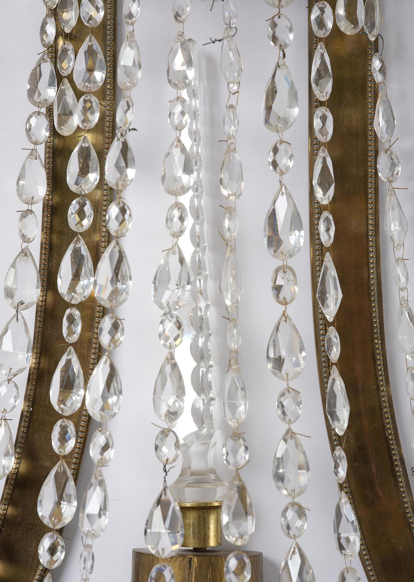 A pair of Russian Louis XVI-style  four-branch gilt bronze appliques, 19th century.
