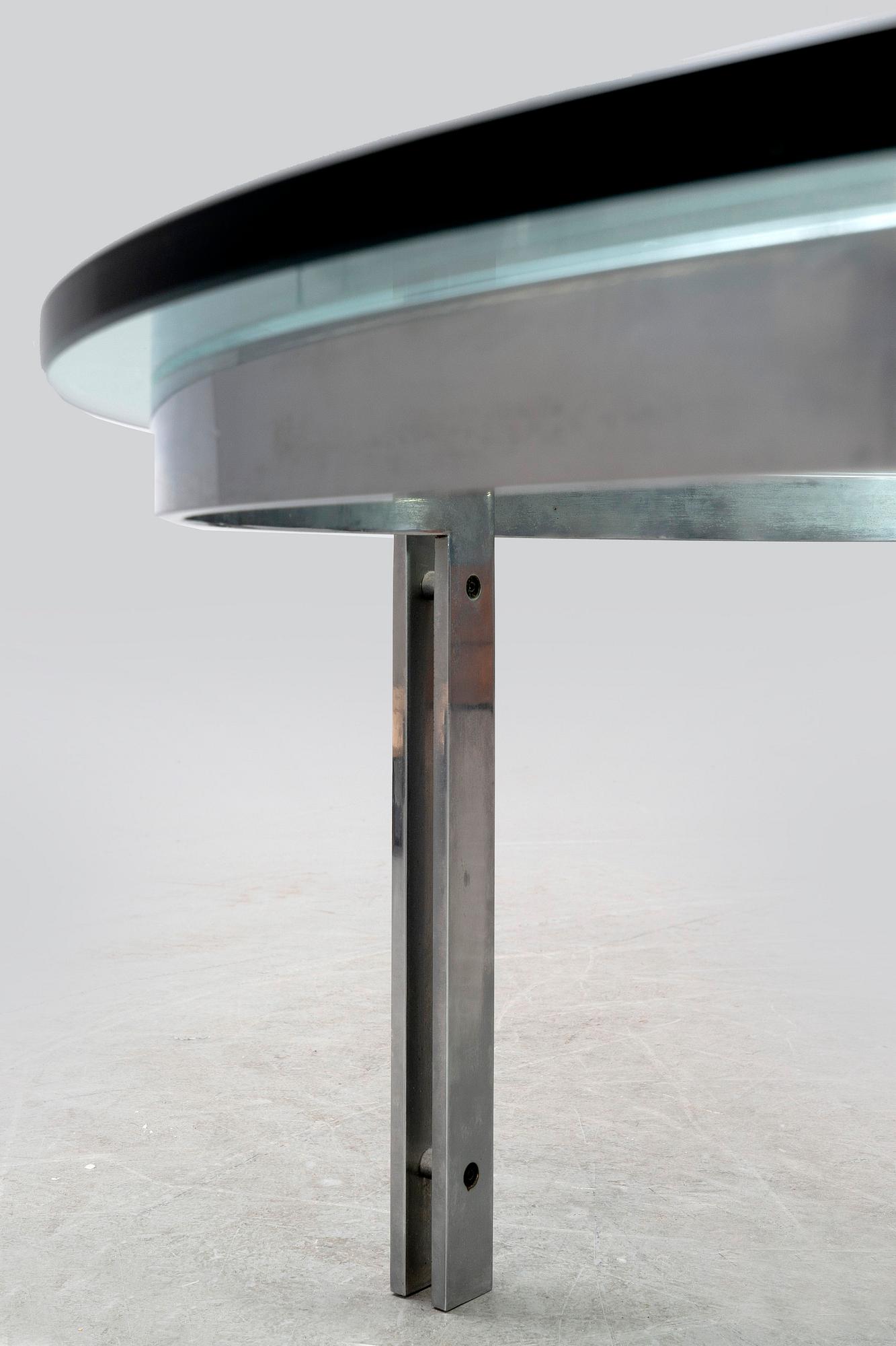 A glass and metal coffee table later part of the 20th century.