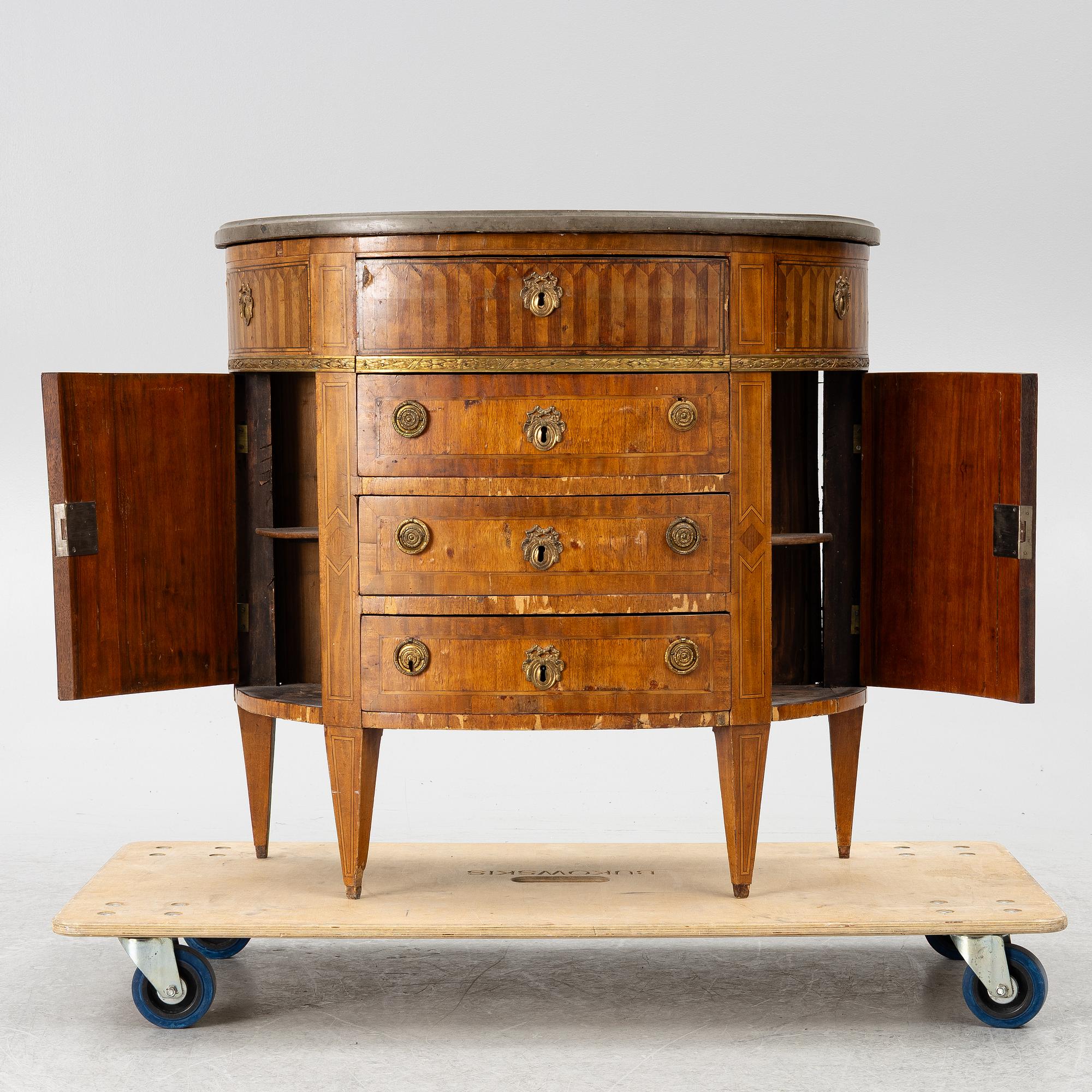 A Louis XVI style chest of drawers, 19th century.