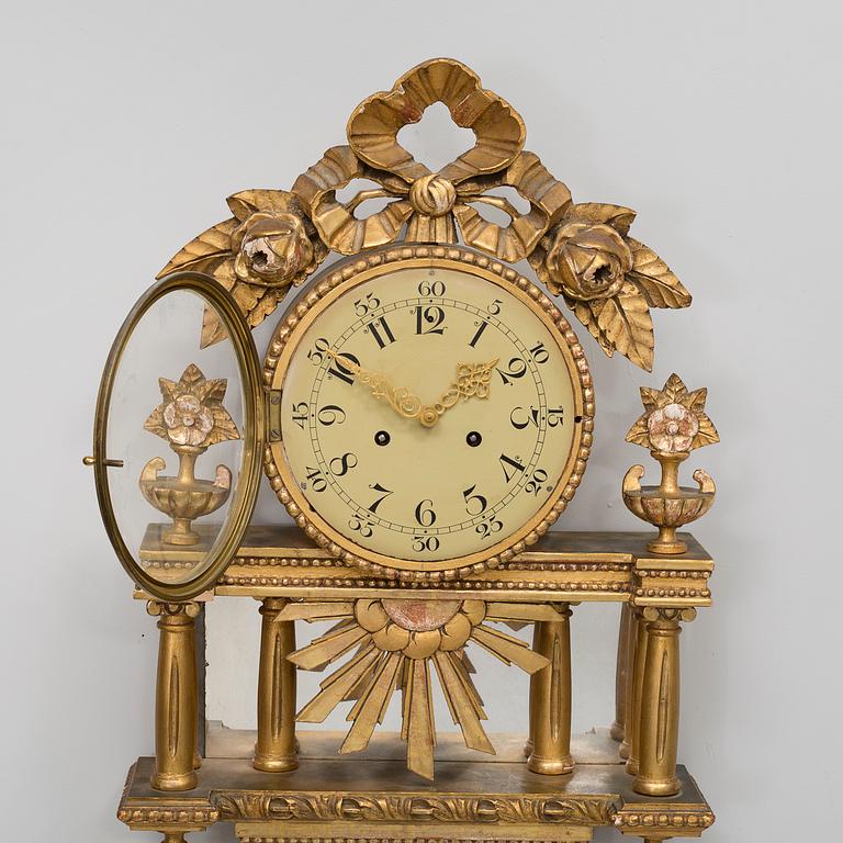 A gustavian style wall clock, first half of the 20th century.