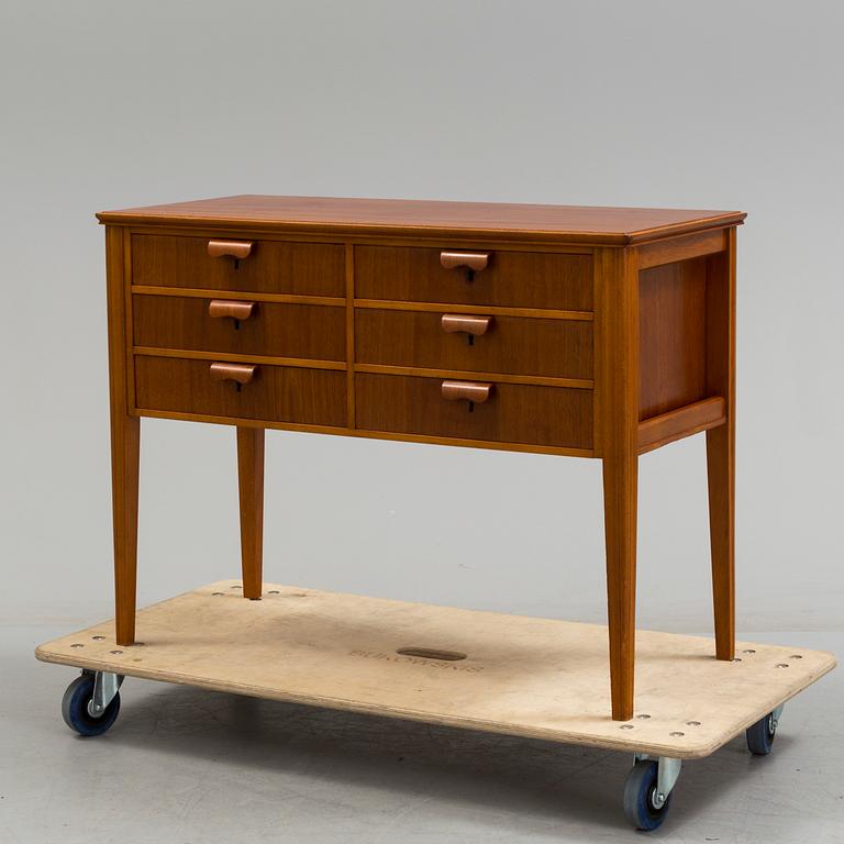 A 1960s teak veneered sideboard.