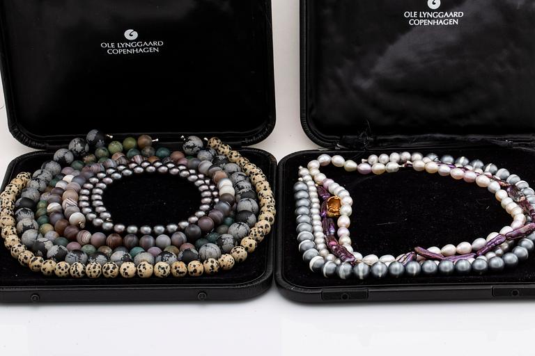 LYNGGAARD, 9 neclaces and clasp 18K gold, original cases, 1 case damaged, lengths approx 40-46 cm.