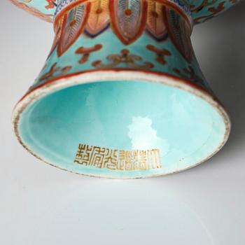 A pair of rare turquoise ground 'baijiaxiang' stemcups, Qing dynasty with Daoguang mark and period (1821-1850).