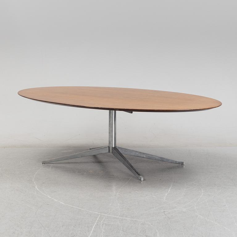 An 'Oval 96' table by Florence Knoll for Knoll International.