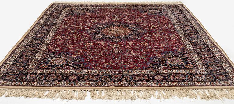 A semi-antique Mashad carpet, signed Saber, c. 401 x 300 cm.