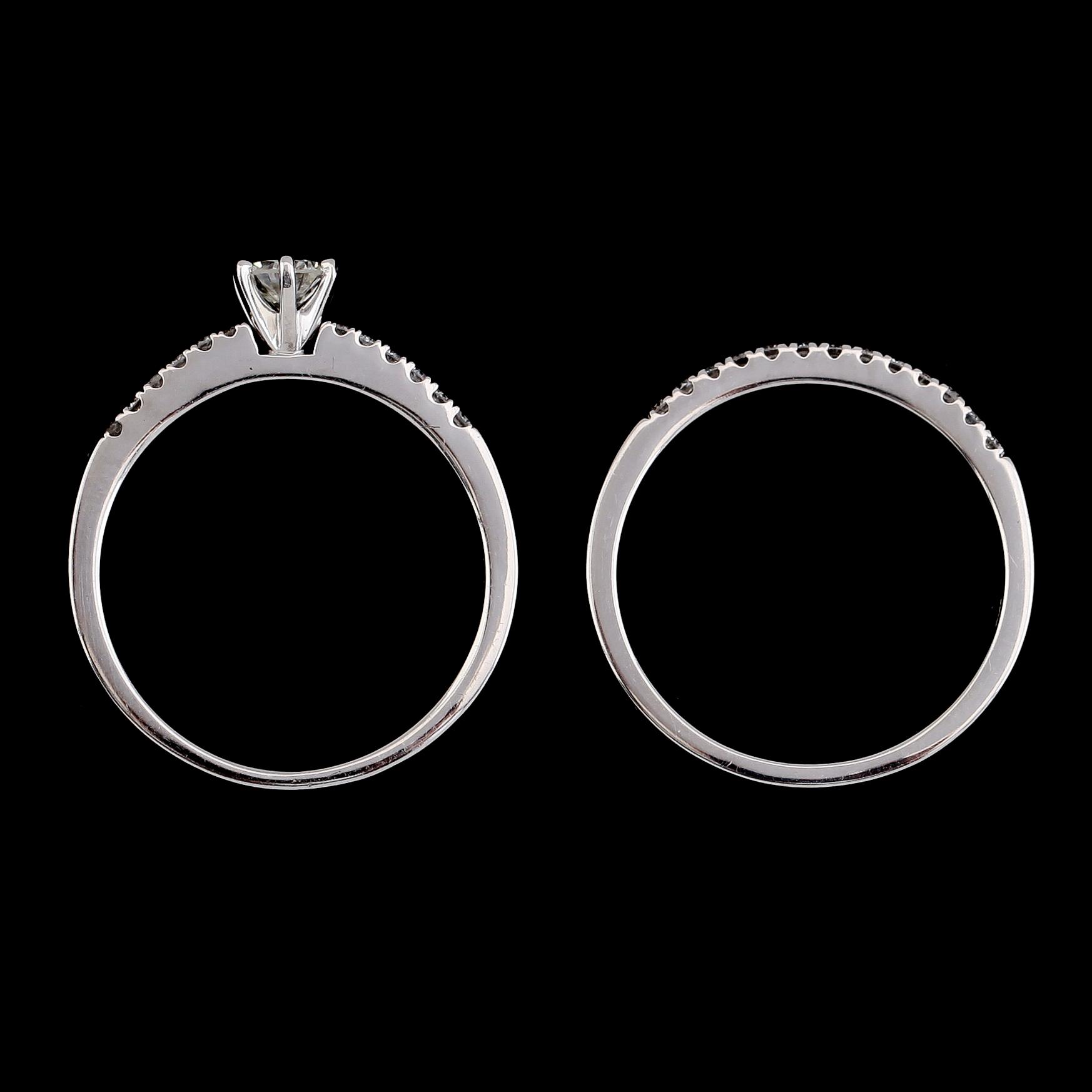RINGAR, 2 st, 14K vitguld, briljantslipade diamanter tot ca 0.50 ct. Vikt ca 3 g.