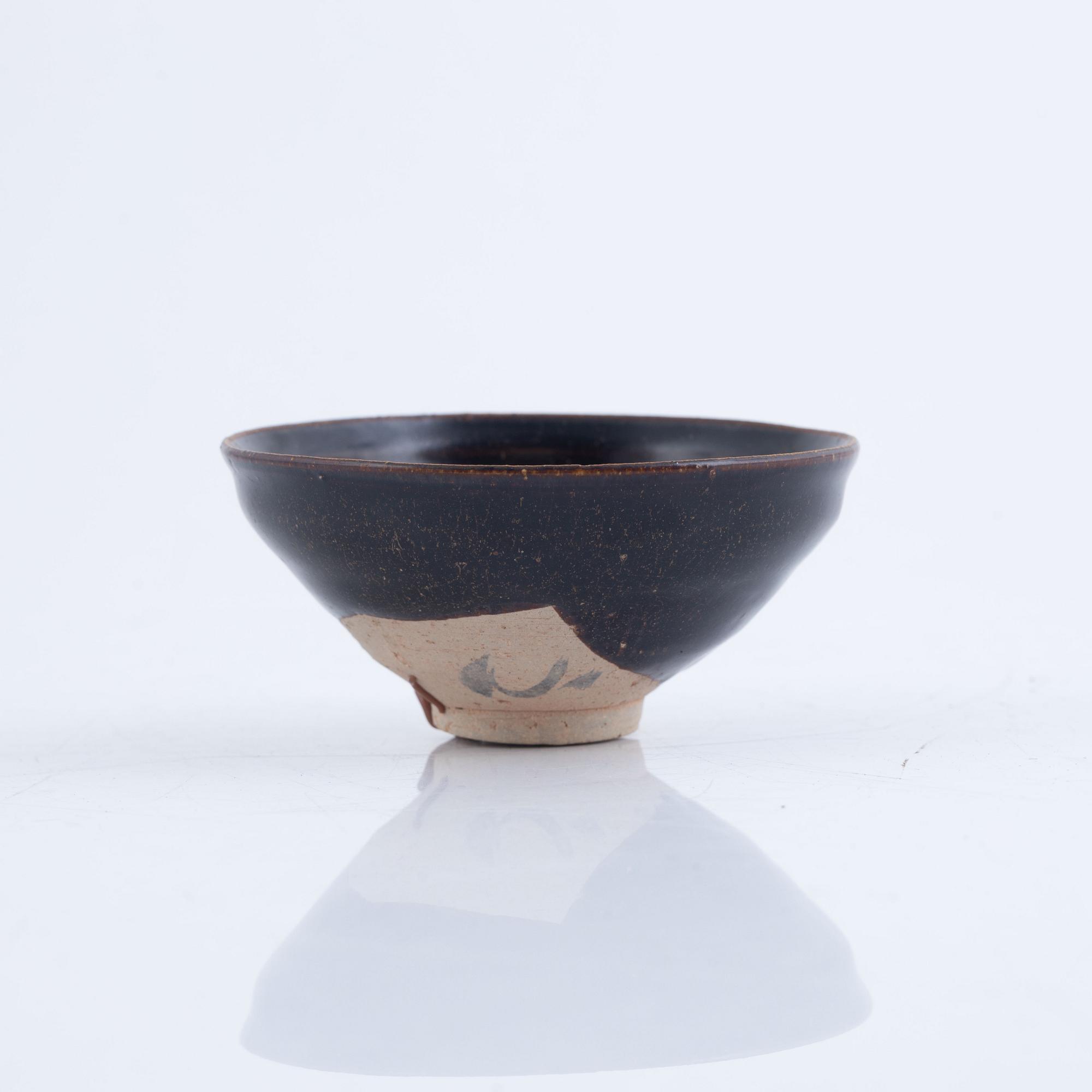 A tenmoku glazed Song style bowl, probably later.