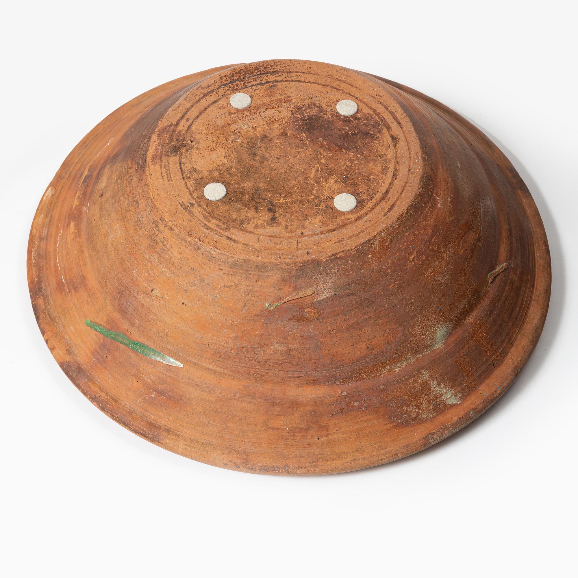 One eathenware bowl and two plates.