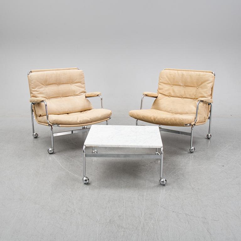 Bruno Mathsson, a pair of easy chairs and a coffee table, 'Karin', Dux, second half of the 20th Century.