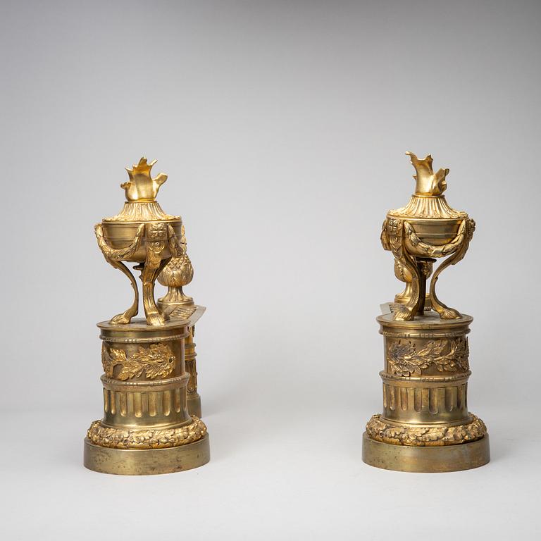 A pair of gilt brass Louis-XVI style andirons, second half of the 19th Century.