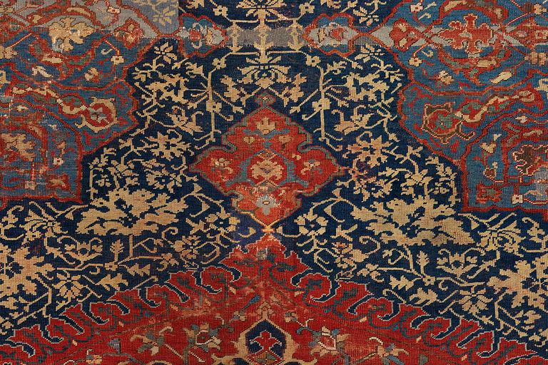 A variant of a 'Medallion' Ushak carpet fragment, West Anatolia, c. 260 x 285, late 16th century.