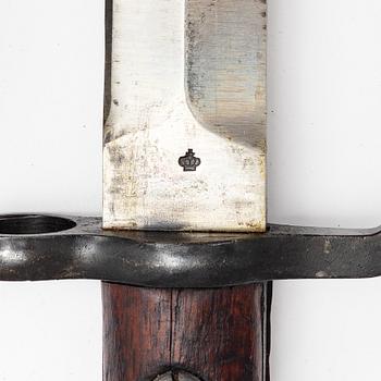 Three Swedish bayonets with scabbards.