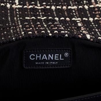 A tweed bag "Classic flip bag XL" by Chanel from 2016-2017.