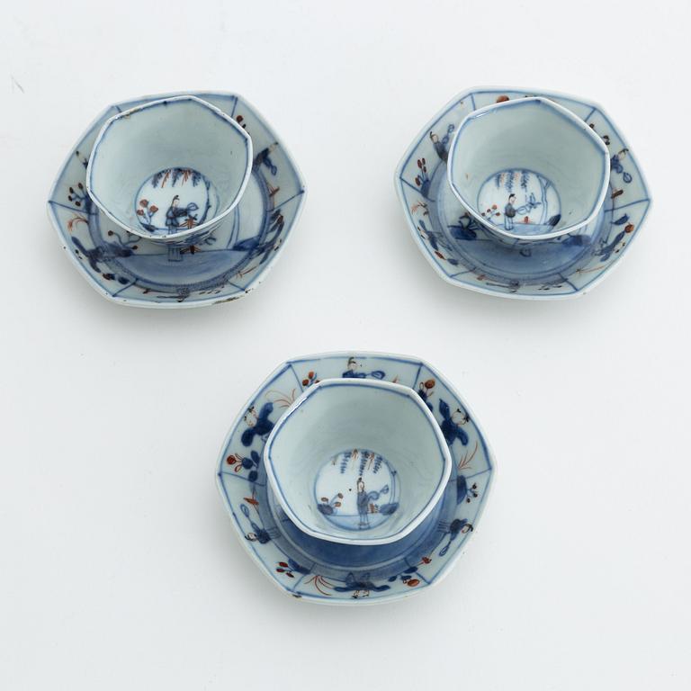 Three Chinese porcelain cups and saucers, Qing dynasty, 18th century.